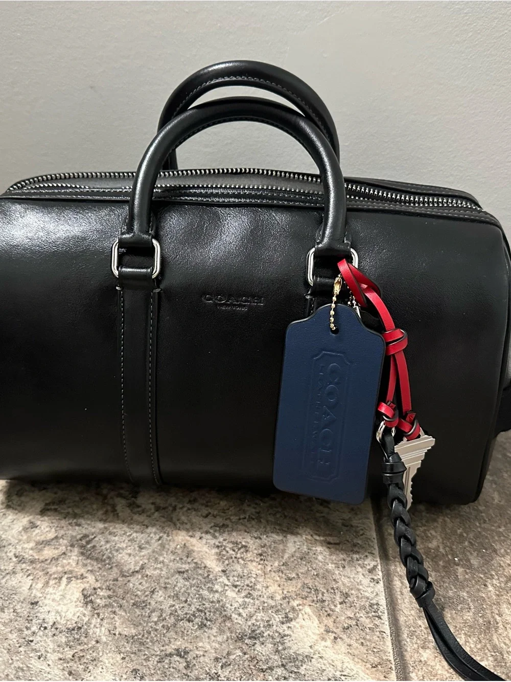 NWT Coach Venturer Black Duffel Bag 27 with bag charms